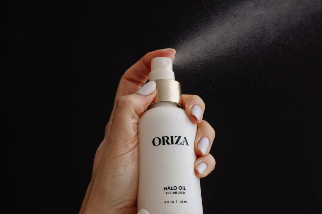 Oriza Halo Oil rice-infused hair spray being applied