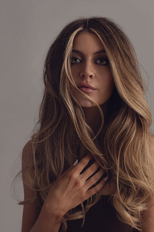 Model with fine, low-porosity hair after using Oriza fermented rice water